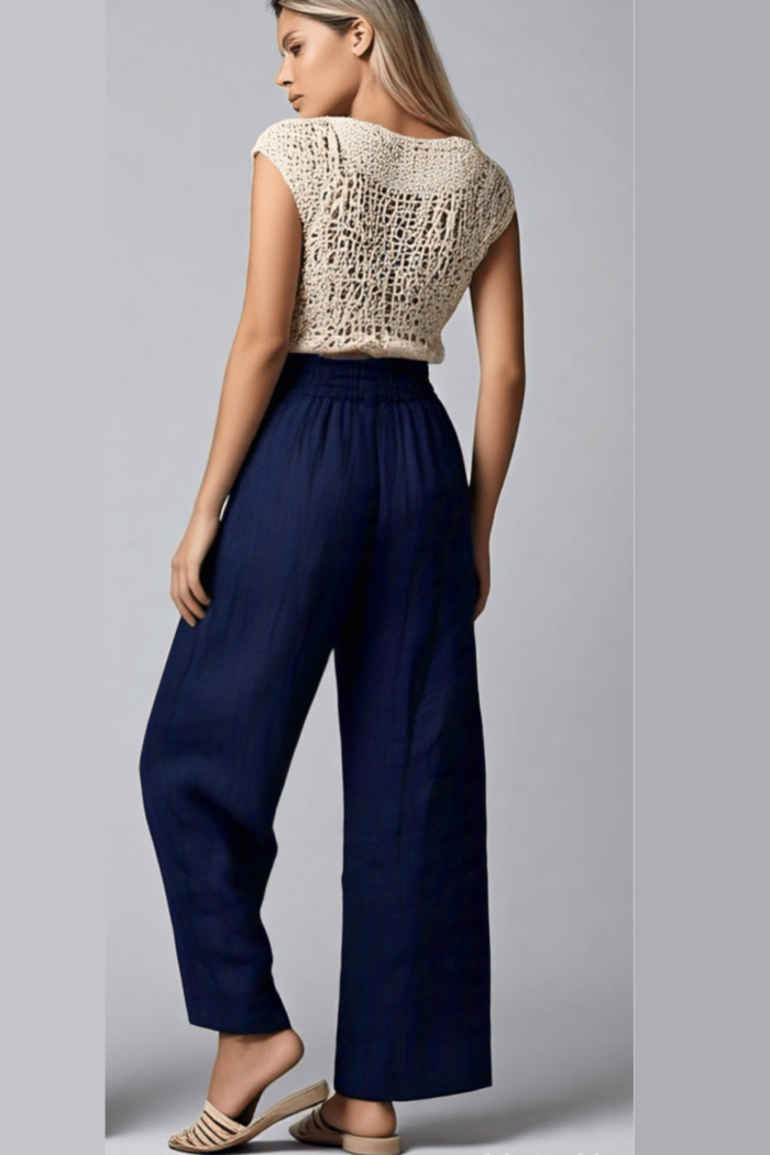 Pantalón palazzo azul marino de lino con cintura elástica y bolsillos.